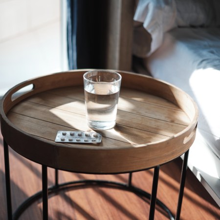Pills and water on a table