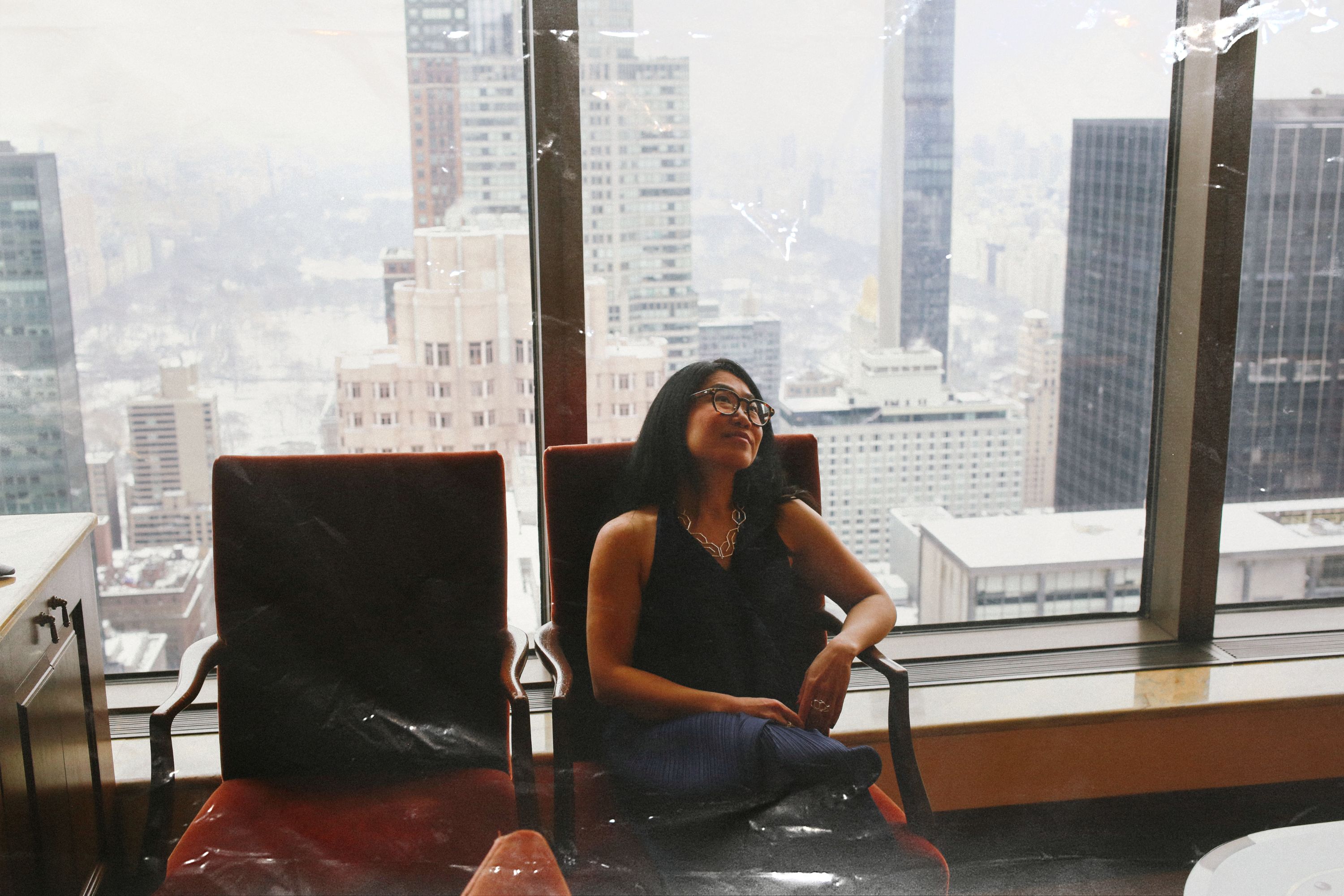 The puzzle editor behind Connections sitting in a chair in the top floor of an office building