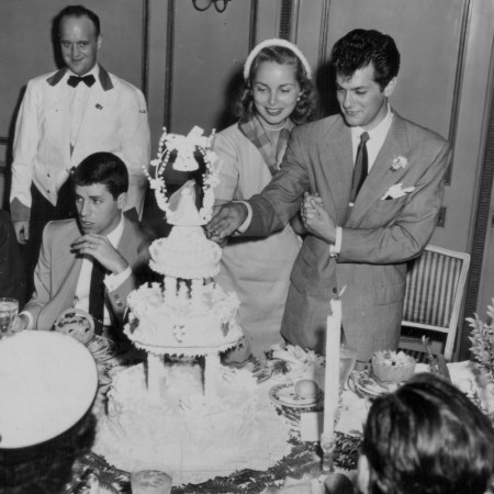 Actors Tony Curtis and Janet Leigh cutting the cake on their wedding day, June 4th 1951