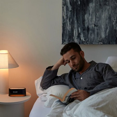 Lifestyle image lamp and clock man reading