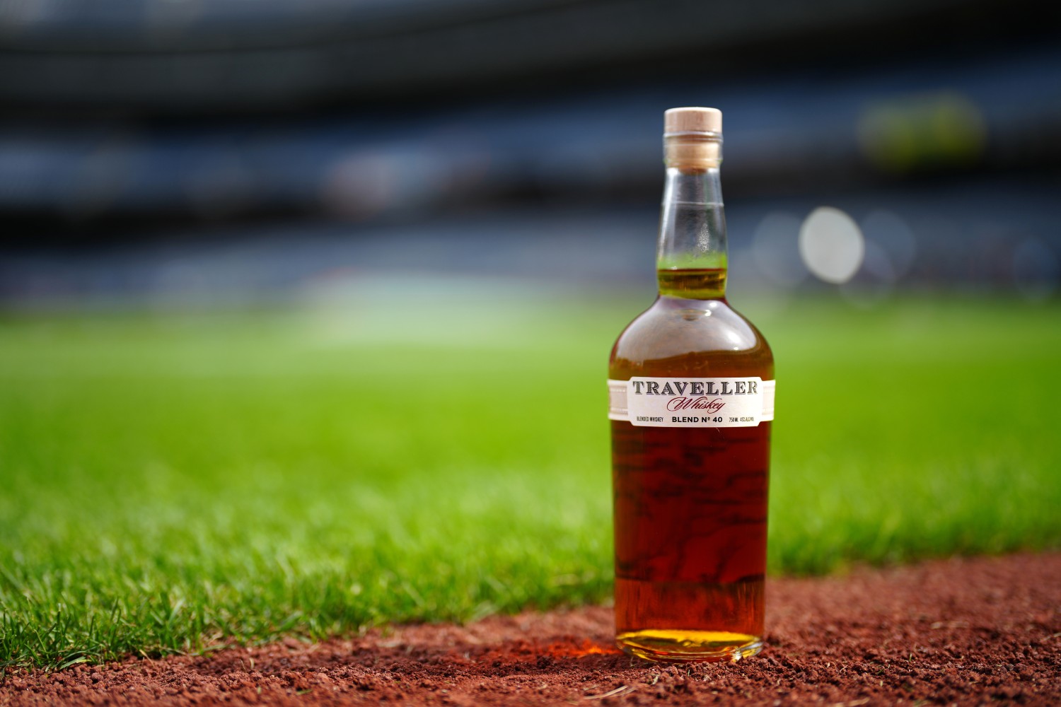 Traveller Whiskey bottle on a baseball field
